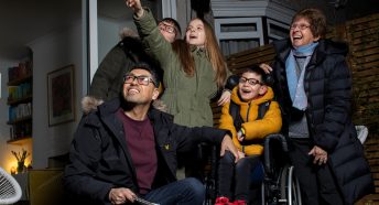 Family pointing at the sky