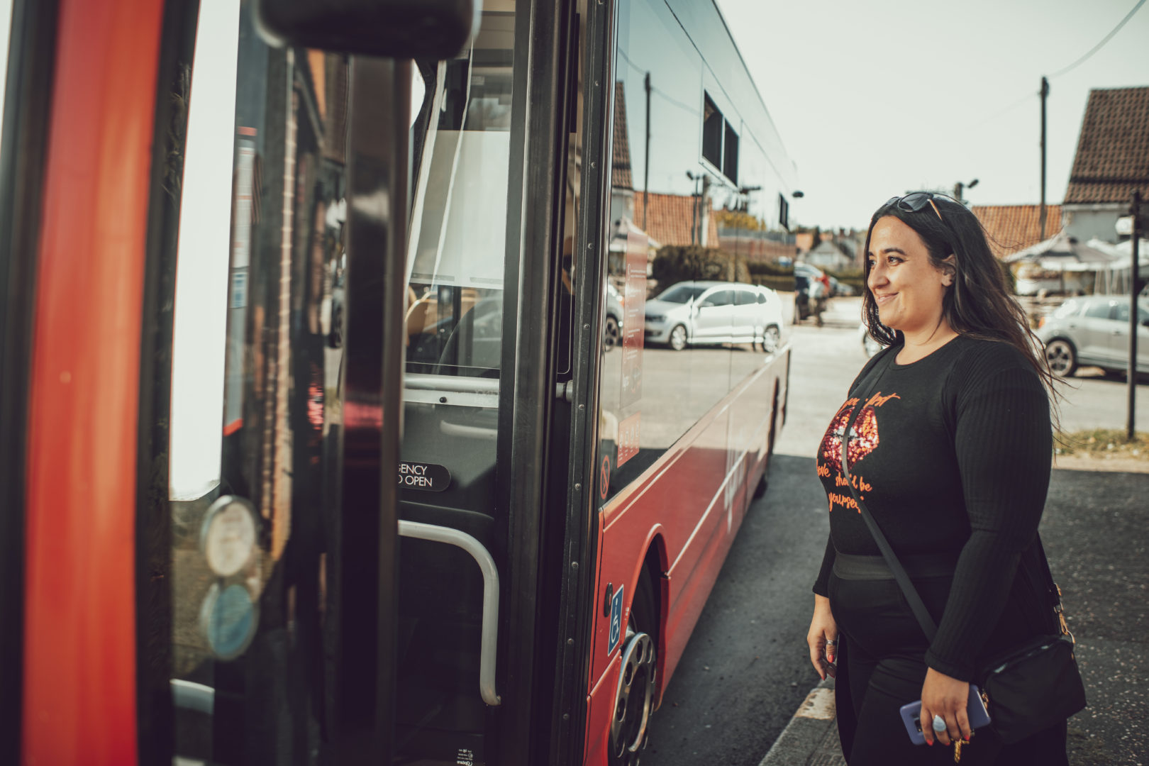 Woman getting on a bus