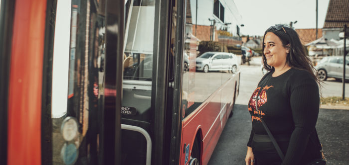 Woman getting on a bus
