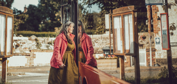 Woman getting on a bus