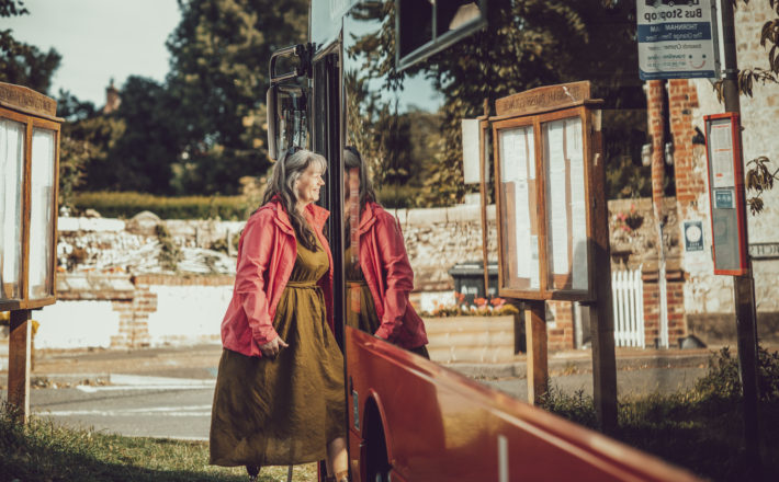 Woman getting on a bus