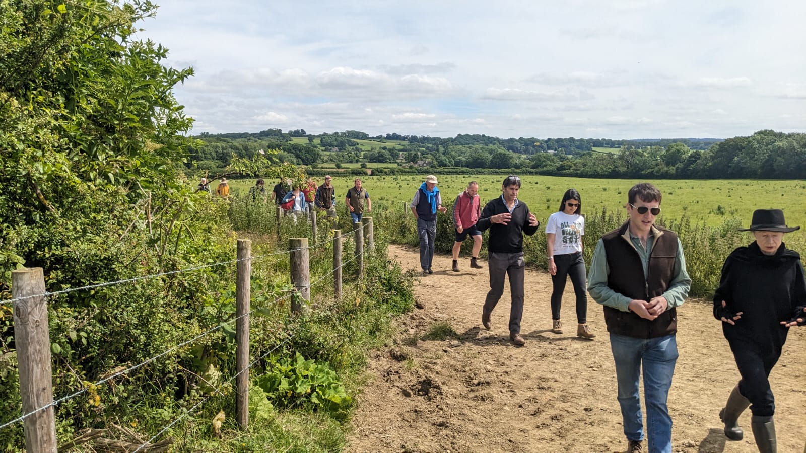 A group of people on a farm walk