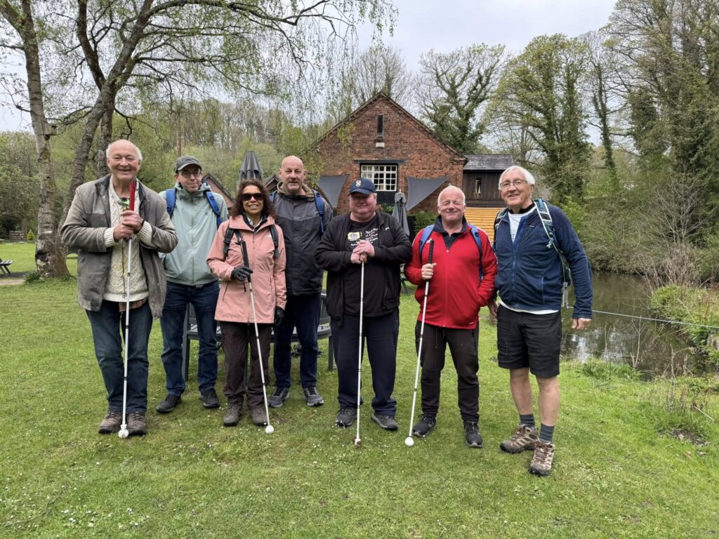 A group of people standing in front of a building